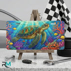 sea turtle vanity plate on display stand — vivid ocean blue coral reef aluminum plate
