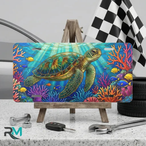 sea turtle vanity plate on display stand — vivid ocean blue coral reef aluminum plate