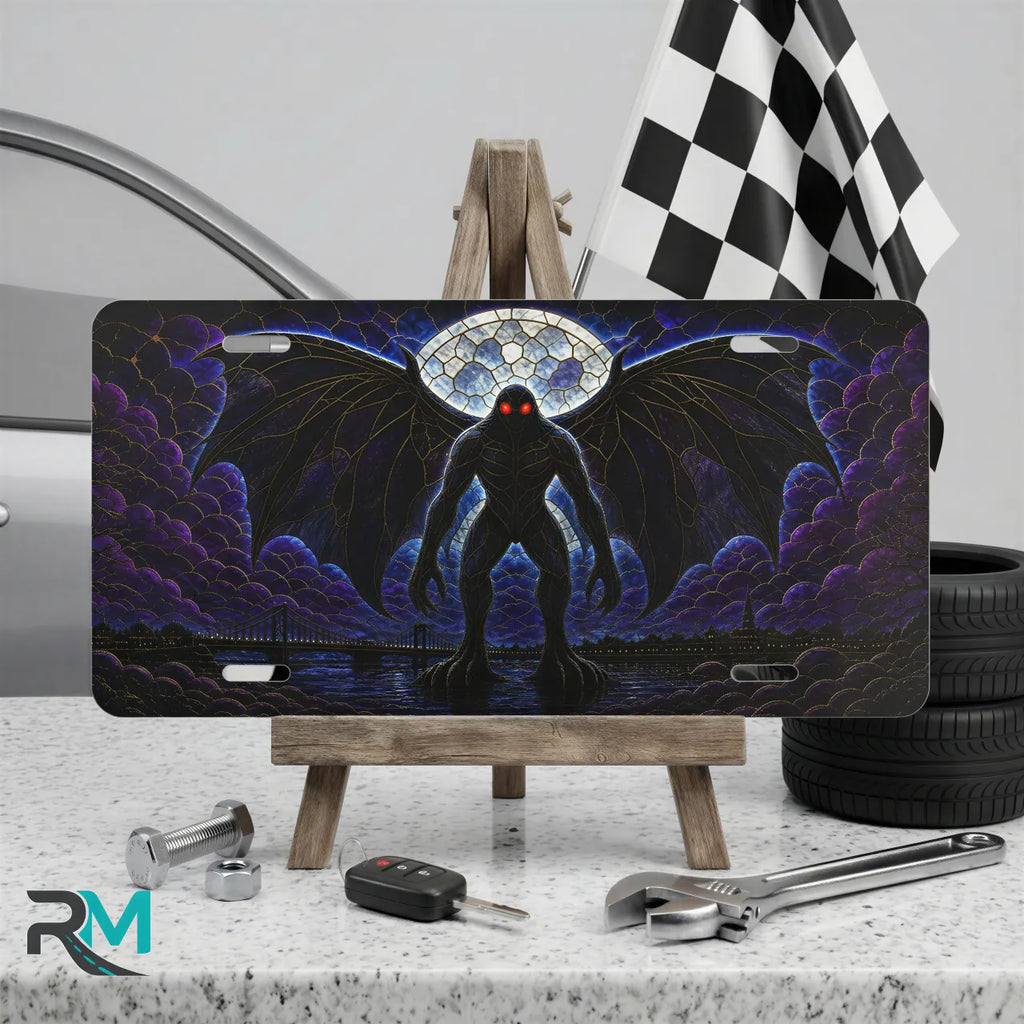 mothman vanity plate on display stand — deep purple winged mothman red eyes aluminum plate