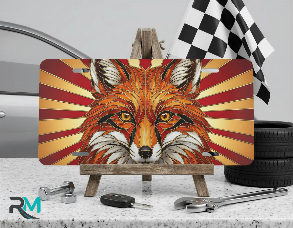 red fox face vanity plate on display stand — vivid red gold wildlife aluminum plate