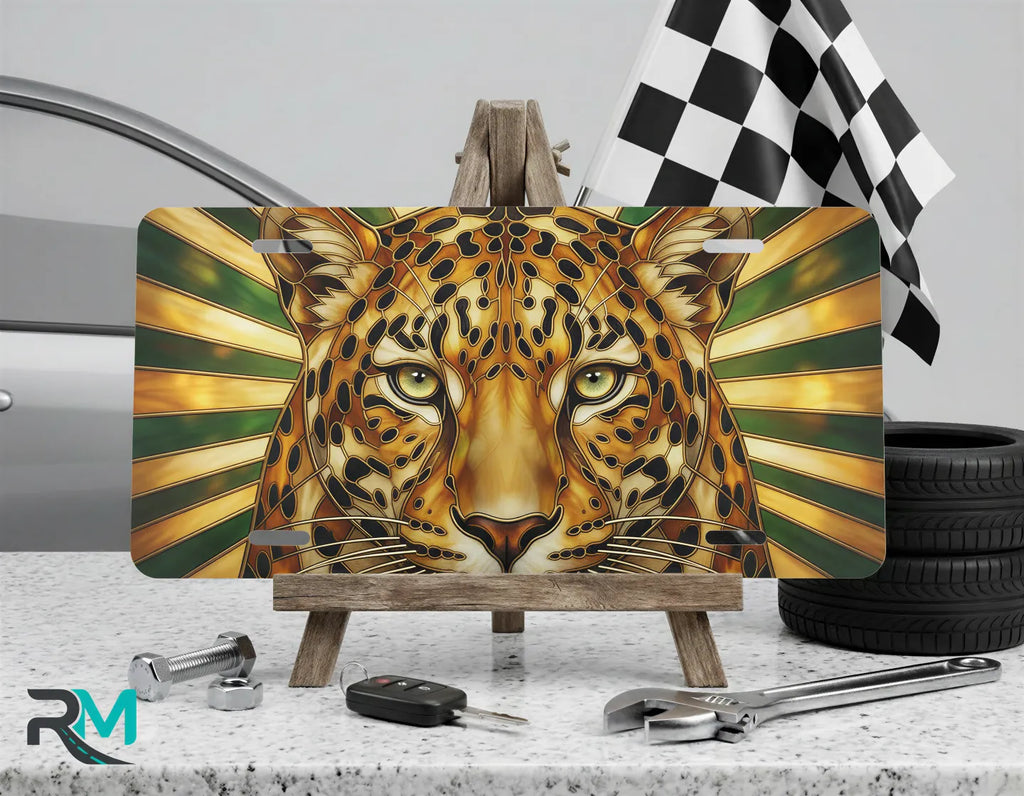 leopard face vanity plate on display stand — golden ochre green amber cat aluminum plate