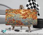 autumn maple stream vanity plate on tire — warm orange gold maple leaves autumn river front license plate