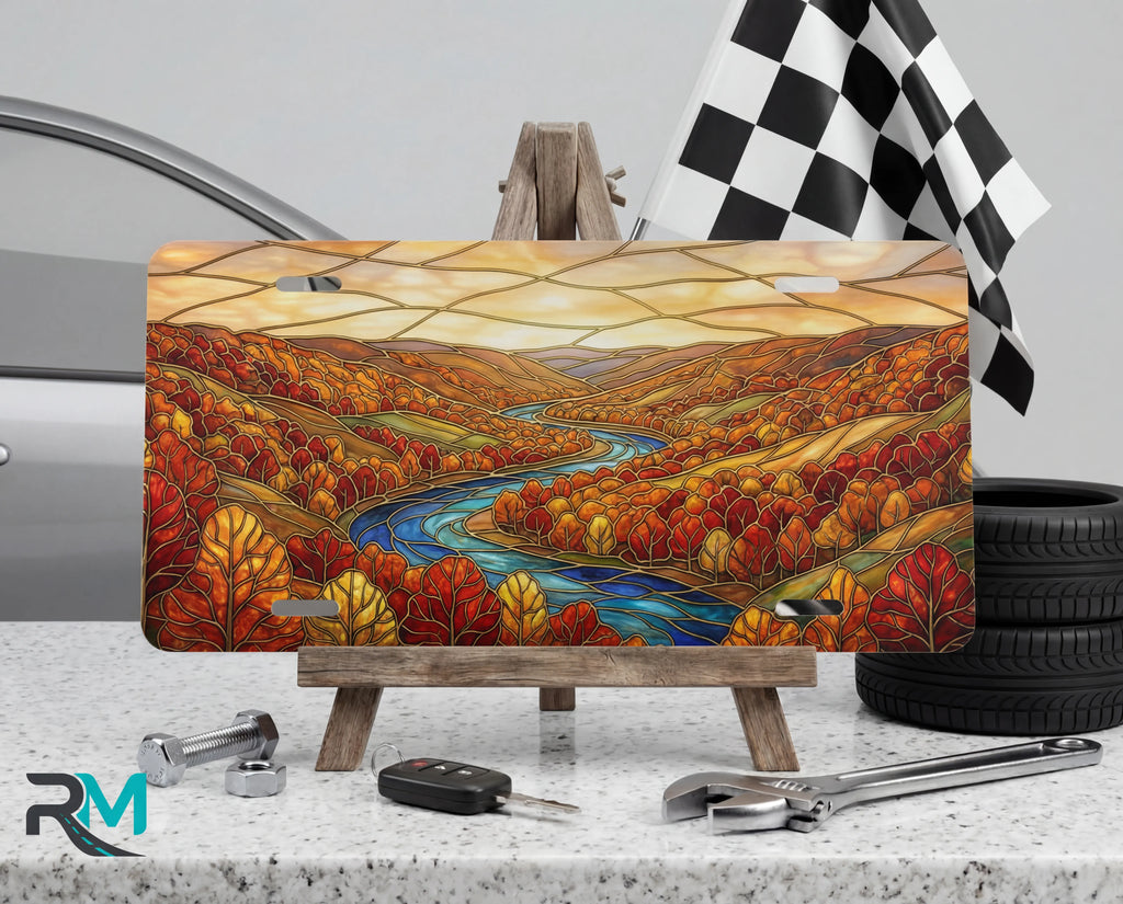 autumn river landscape vanity plate on tire — rich autumn red gold winding river fall front license plate