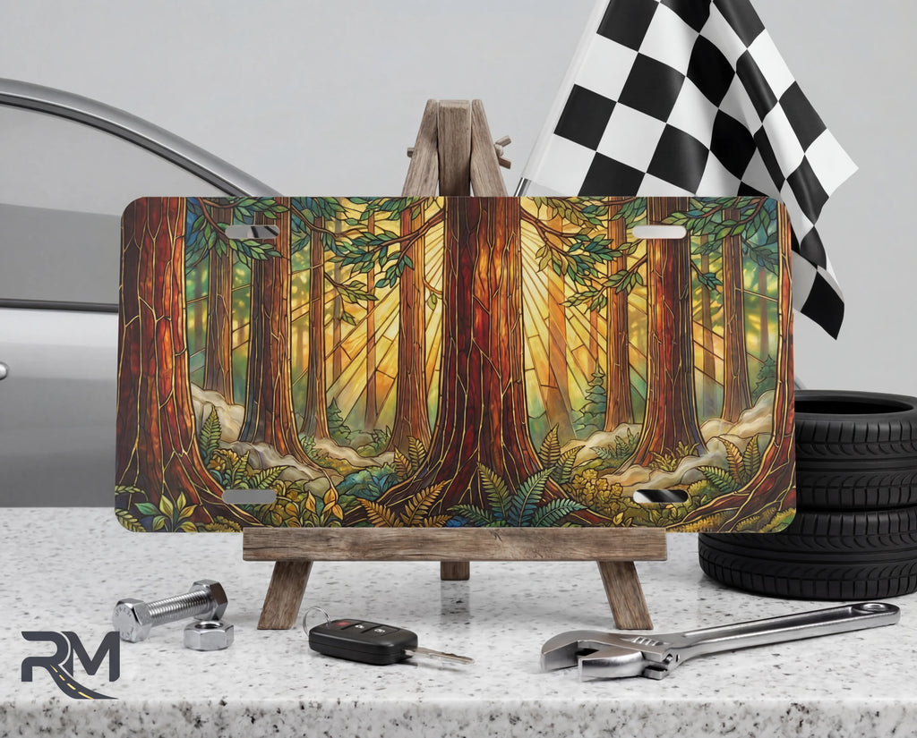 redwood forest vanity plate on display stand — warm amber golden light redwood trunks aluminum plate