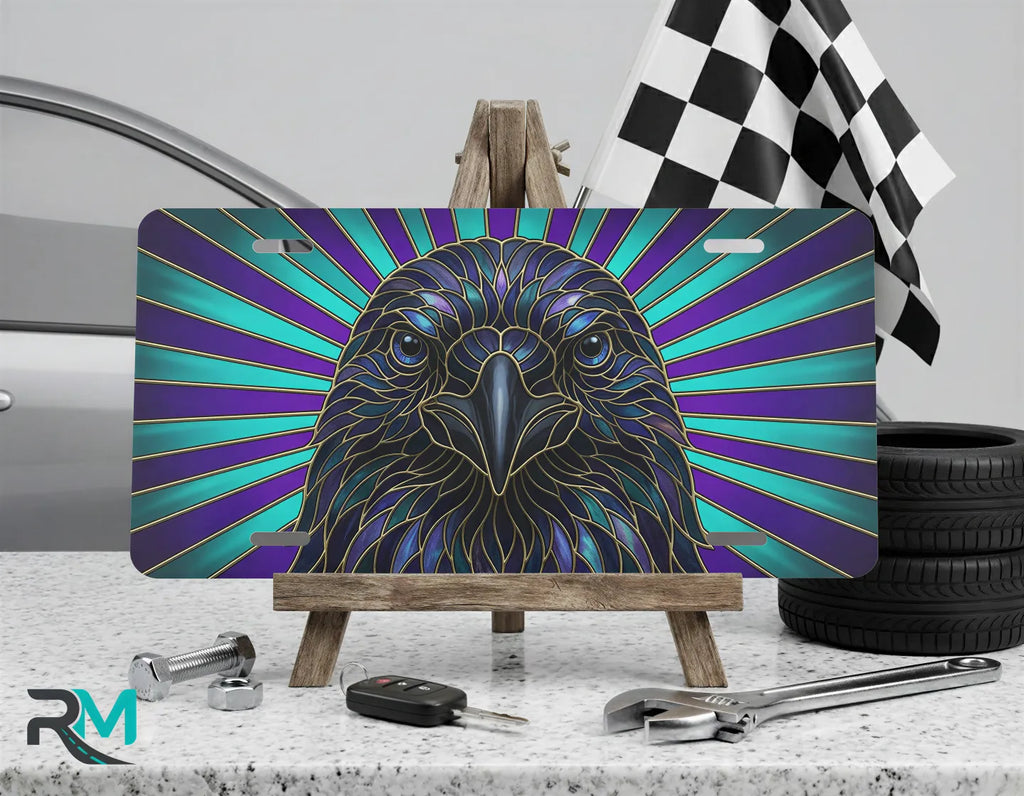 raven head radiant rays vanity plate on display stand — jewel-tone stained glass bird plate