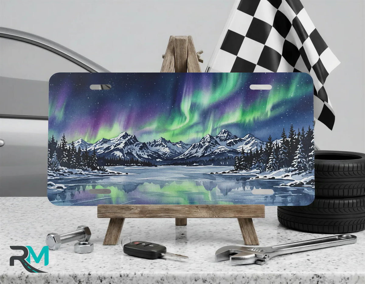 northern lights vanity plate on display stand — vivid green purple aurora borealis art