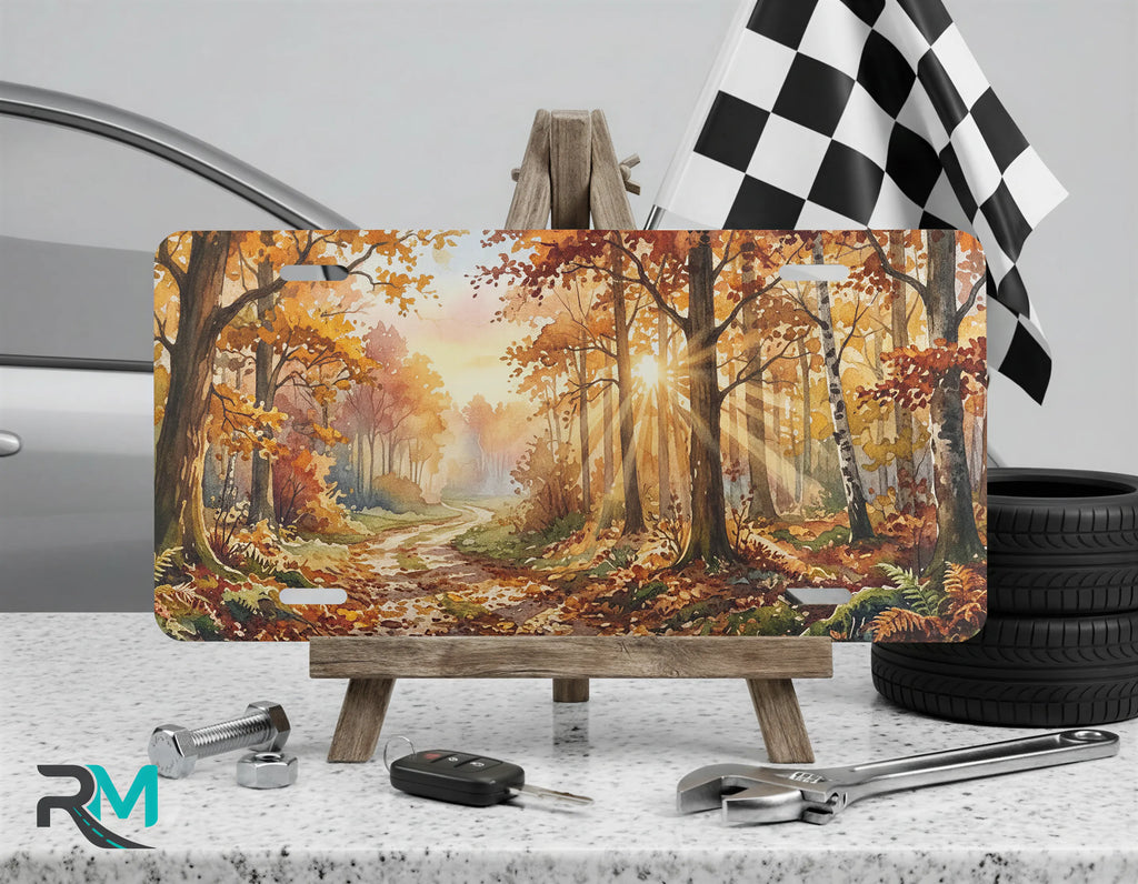 fall forest vanity plate on display stand — amber burnt orange woodland path license plate