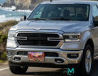 decorative canyon license plate mounted on SUV front bumper — road trip accessory