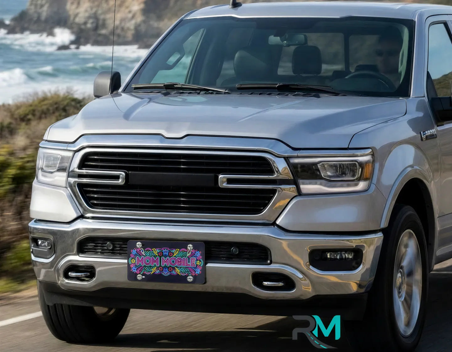 mom mobile vanity plate on SUV — neon retro pink blue yellow front license plate