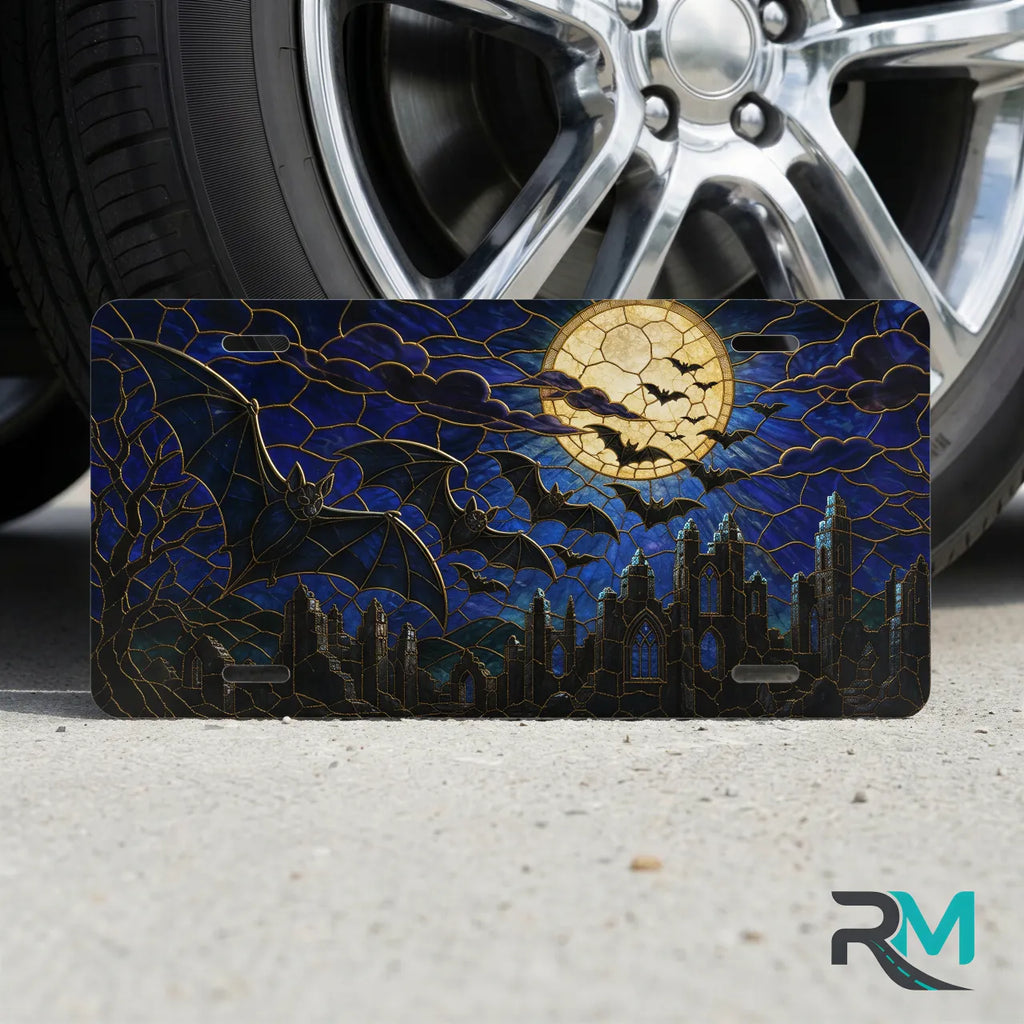 full moon bats vanity plate on tire — midnight blue bat cracked moon gothic front license plate