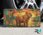 capybara sunset vanity plate on tire — golden capybara wetland tropical front license plate