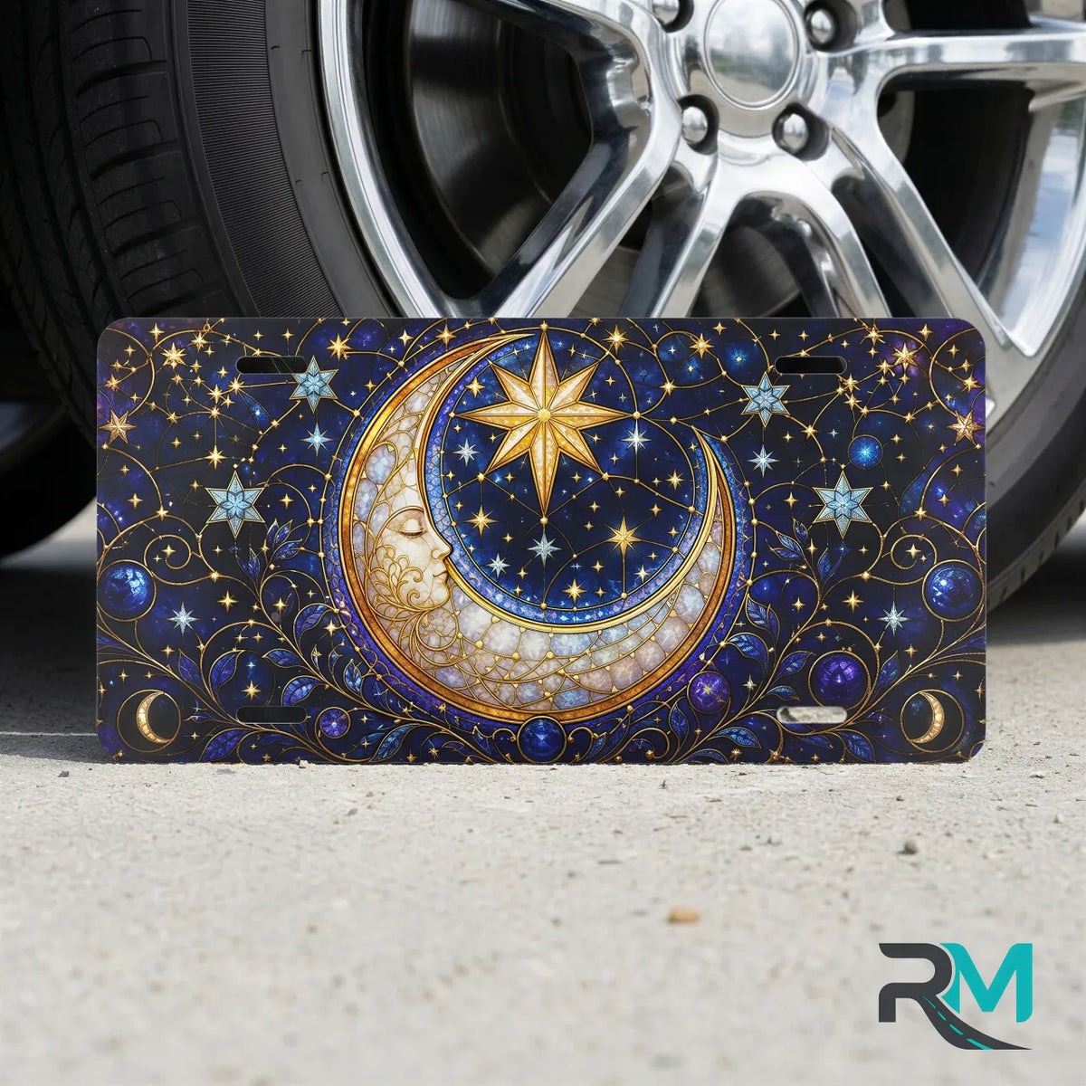 moon star vanity plate on tire — deep indigo crescent moon gold stars front license plate