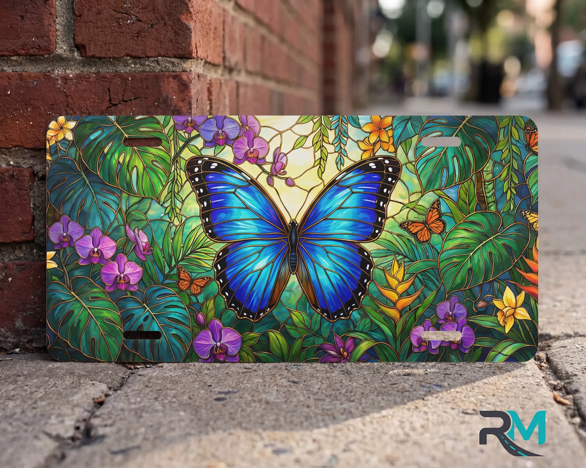 blue butterfly vanity plate on wall — vivid sapphire blue butterfly tropical floral close up