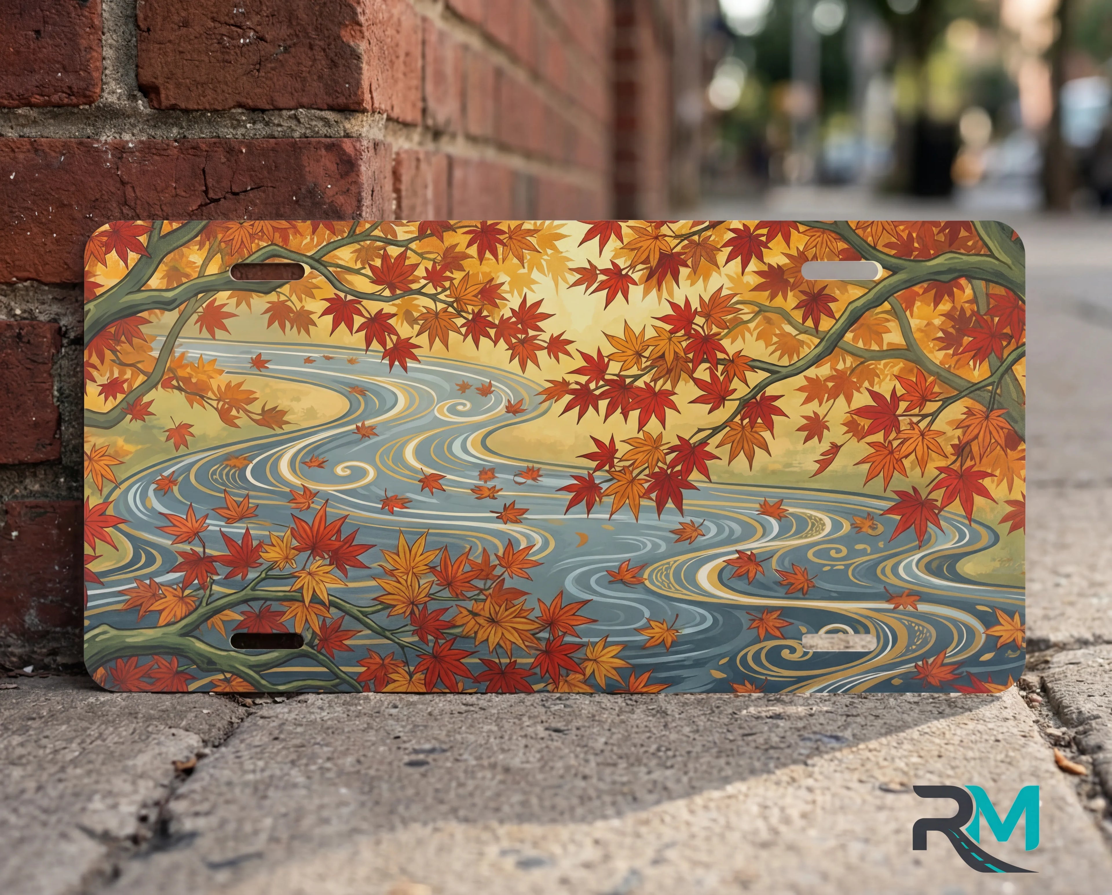 autumn maple stream vanity plate close up — warm orange gold maple leaves winding river autumn detail
