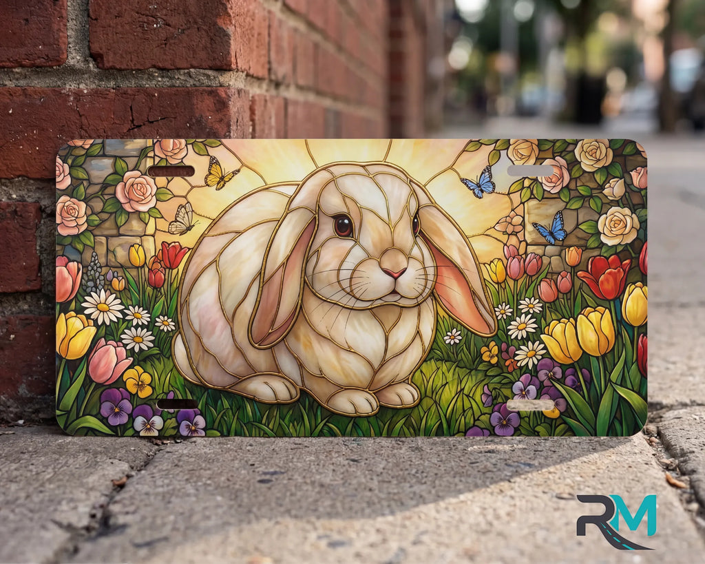 stained glass bunny vanity plate on wall close up — soft pastel rabbit tulip rose garden plate