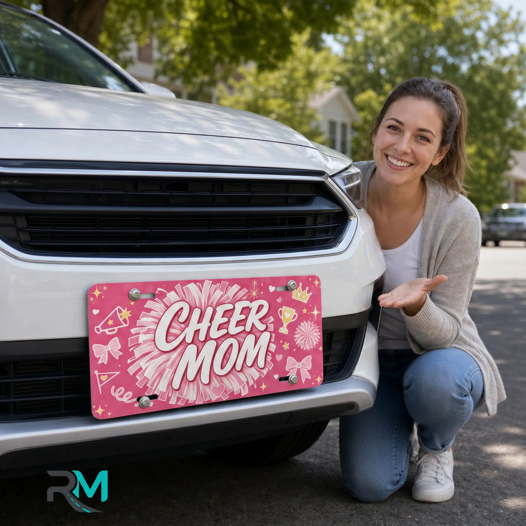 woman with cheer mom vanity plate — hot pink pom-pom cheer front license plate