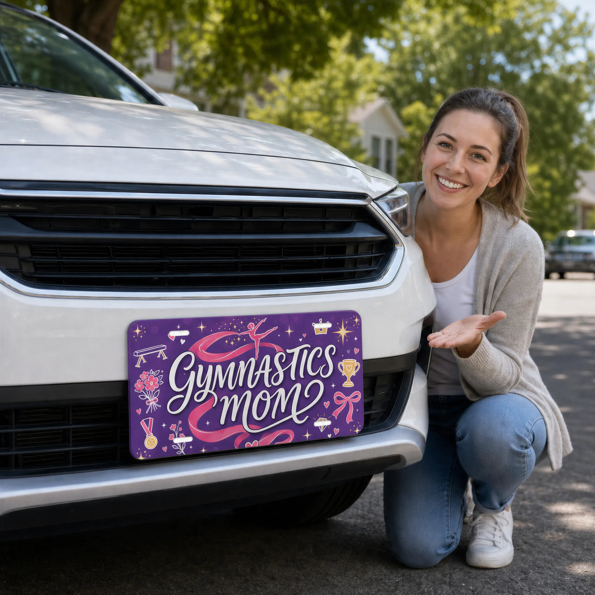 woman with gymnastics mom vanity plate — purple pink ribbon front license plate