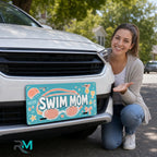 woman with swim mom vanity plate — teal coral SWIM MOM front license plate