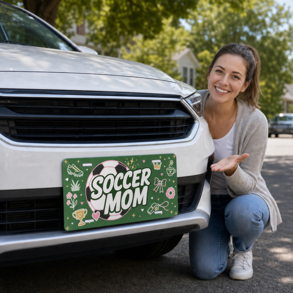 woman with soccer mom vanity plate — pink soccer ball green front license plate
